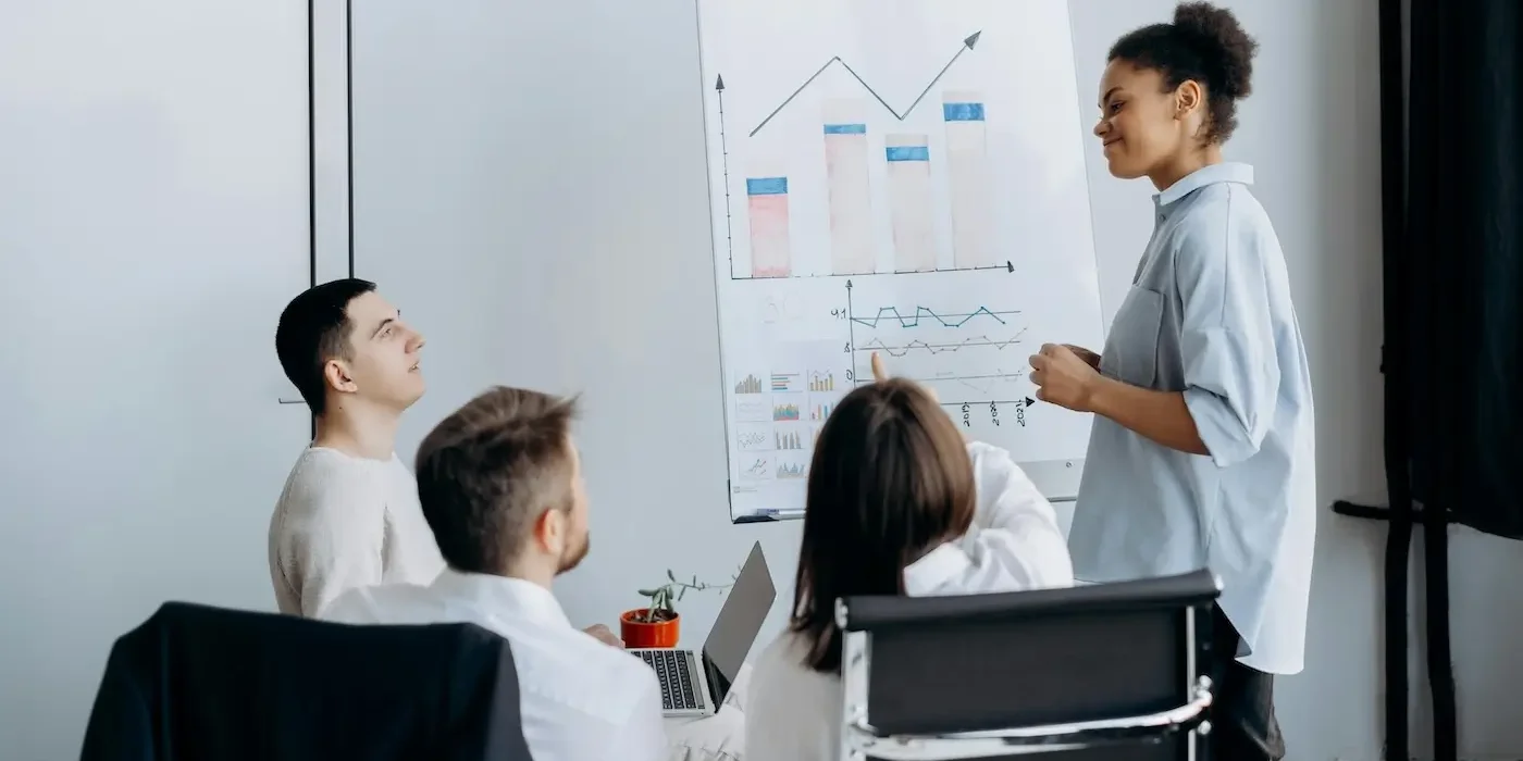 greiner-model-in-action (1) a group of people discussing organizational growth